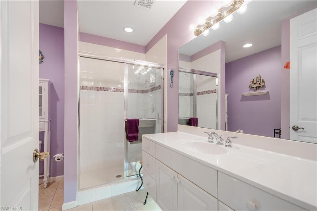 14565 Red Fox Run, Unit 613 Naples, FL 34110 - Photo 28 of 48 a bathroom with a sink and a mirror