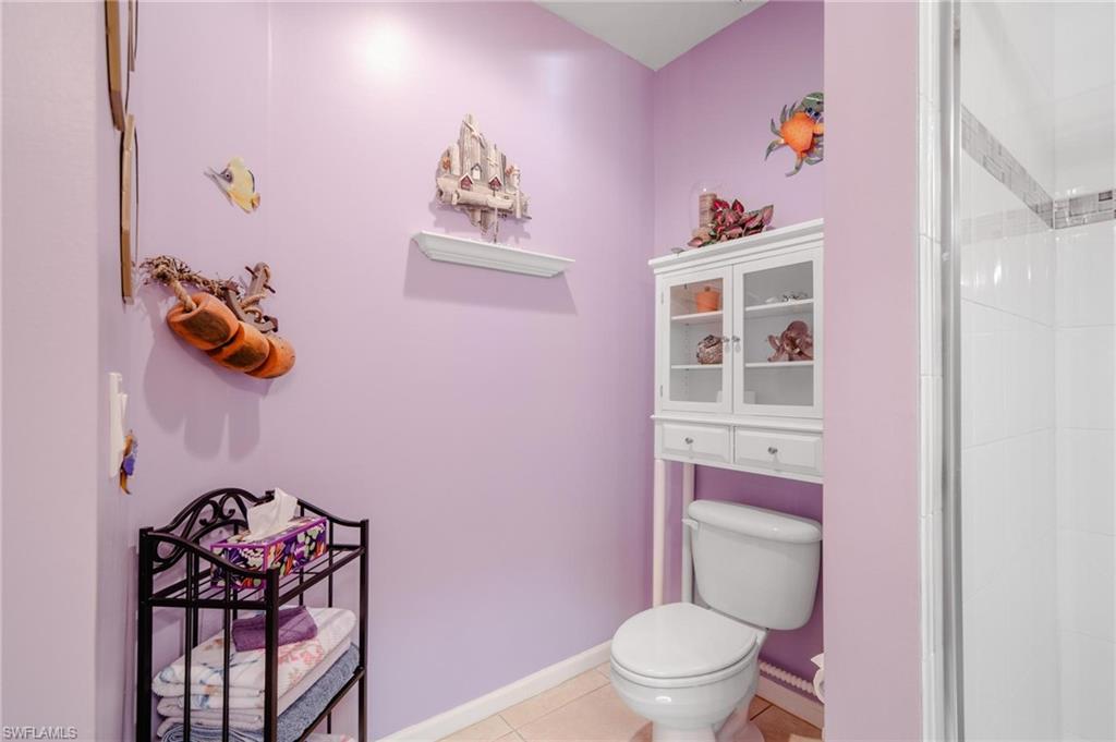 14565 Red Fox Run, Unit 613 Naples, FL 34110 - Photo 29 of 48 a white toilet sitting next to a bathroom sink
