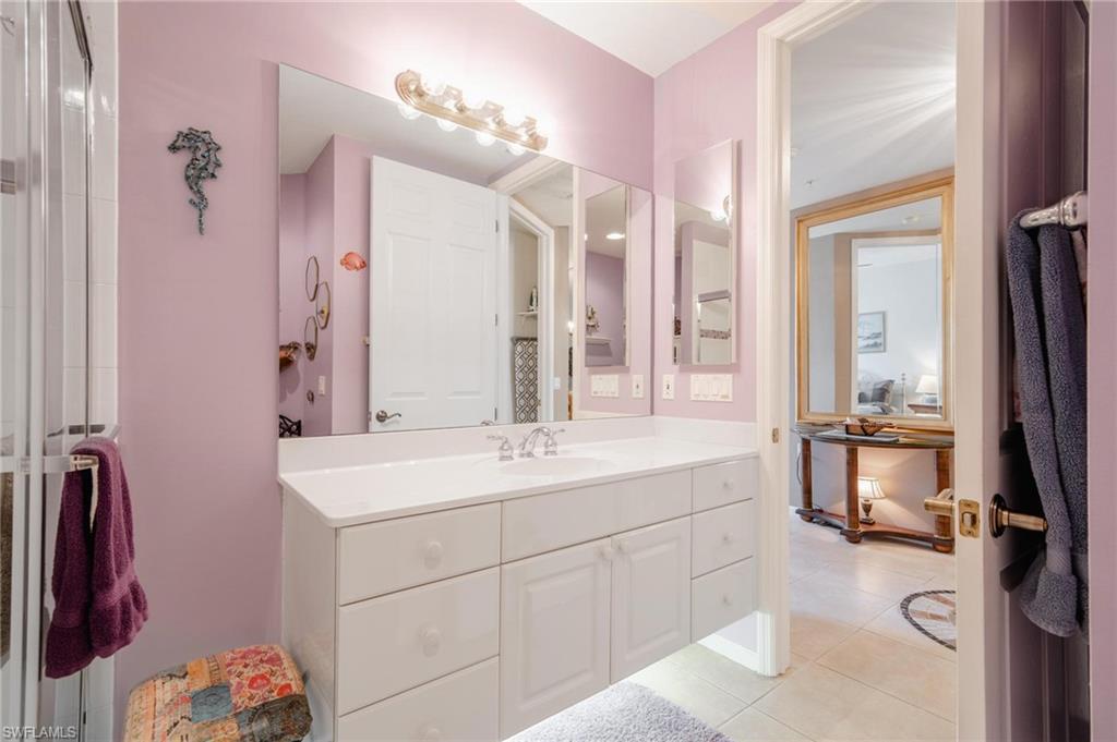 14565 Red Fox Run, Unit 613 Naples, FL 34110 - Photo 30 of 48 a bathroom with a sink vanity tub and shower