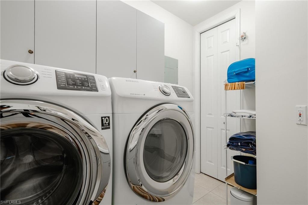 14565 Red Fox Run, Unit 613 Naples, FL 34110 - Photo 34 of 48 a utility room with sink dryer and washer