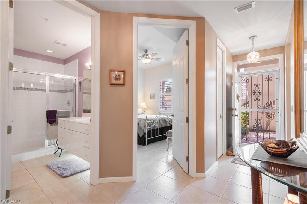 14565 Red Fox Run, Unit 613 Naples, FL 34110 - Photo 35 of 48 a bathroom with a sink and a mirror