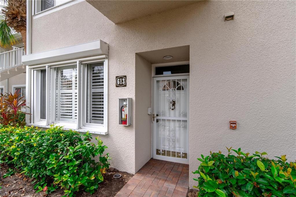 14565 Red Fox Run, Unit 613 Naples, FL 34110 - Photo 38 of 48 front view of a house with an outdoor space