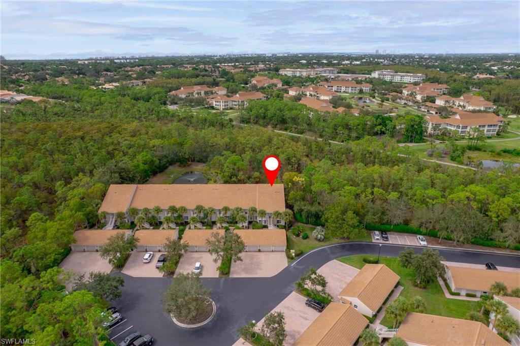 14565 Red Fox Run, Unit 613 Naples, FL 34110 - Photo 42 of 48 an aerial view of residential houses with outdoor space