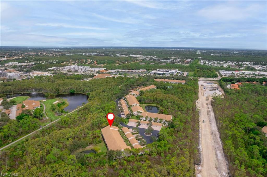 14565 Red Fox Run, Unit 613 Naples, FL 34110 - Photo 44 of 48 an aerial view of house with yard lake and green space