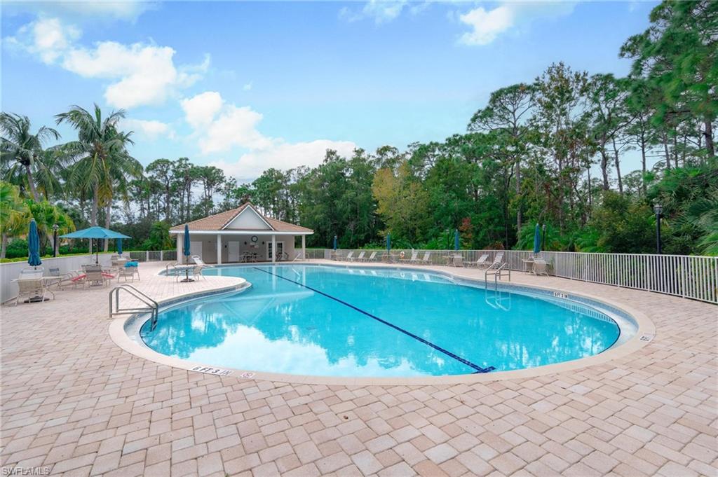 14565 Red Fox Run, Unit 613 Naples, FL 34110 - Photo 45 of 48 a view of a swimming pool with a yard