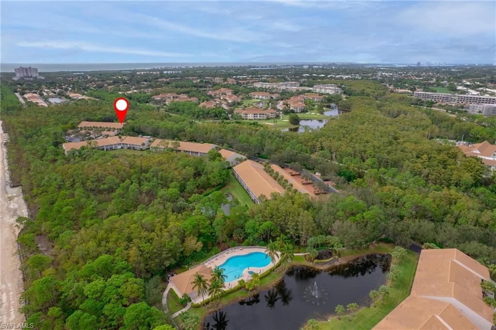 14565 Red Fox Run, Unit 613 Naples, FL 34110 - Photo 47 of 48 an aerial view of a city with lots of residential buildings ocean and mountain view in back