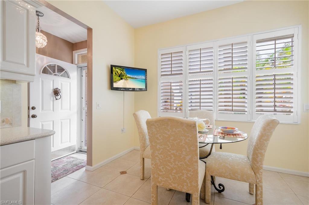 14565 Red Fox Run, Unit 613 Naples, FL 34110 - Photo 7 of 48 a view of a dining room with furniture window and outside view