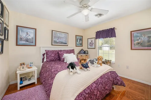 a bed room with a bed and a chandelier