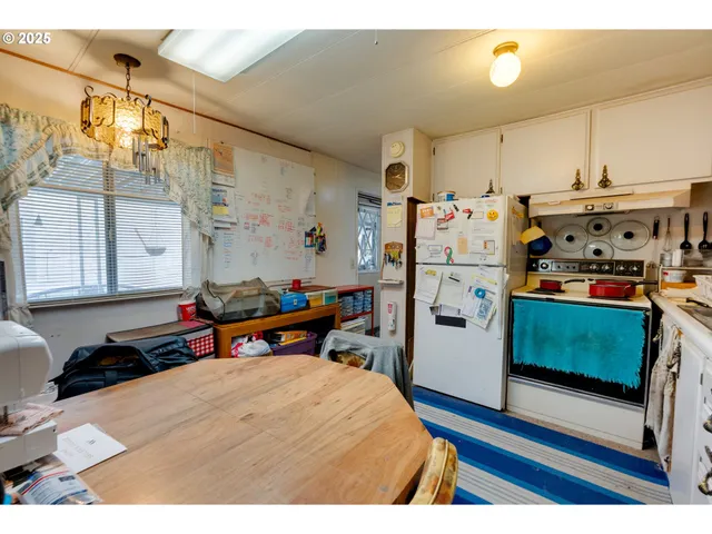 a view of a kitchen with appliances and cabinets