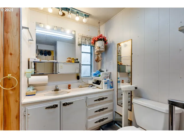 a view of a bathroom from a hallway