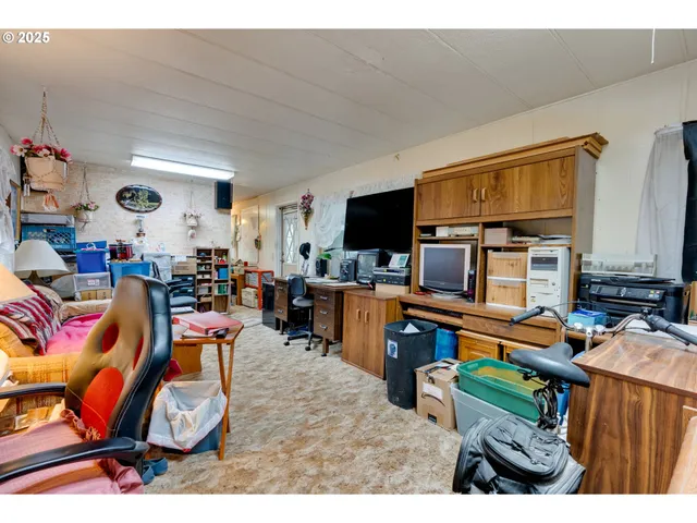 a view of a workspace with furniture