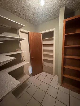 a kitchen with stainless steel appliances a stove a microwave and a sink