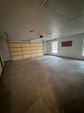 a kitchen with a sink cabinets and appliances