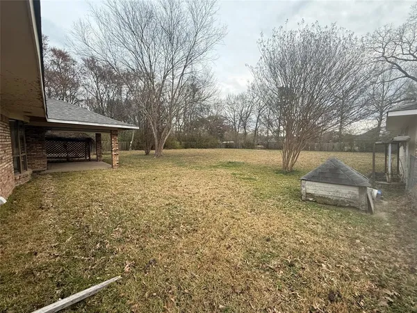 a backyard of a house with lots of green space