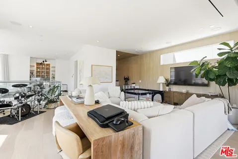 a living room with lots of furniture and a flat screen tv