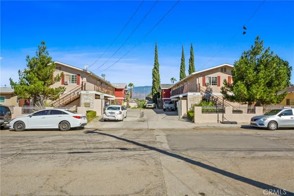 a view of street with parked cars