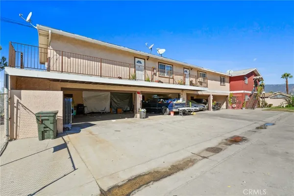 a view of a backyard with a table and chairs