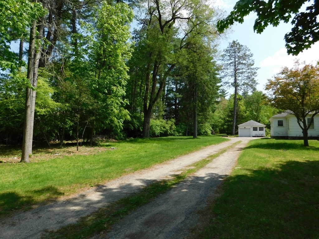 225 Rockingham Road Londonderry, NH 03053 - Photo 1 of 28 a view of a park with large trees