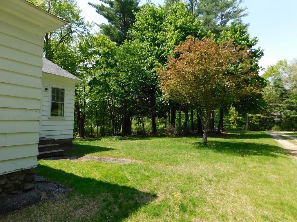 225 Rockingham Road Londonderry, NH 03053 - Photo 26 of 28 a view of a backyard with a garden