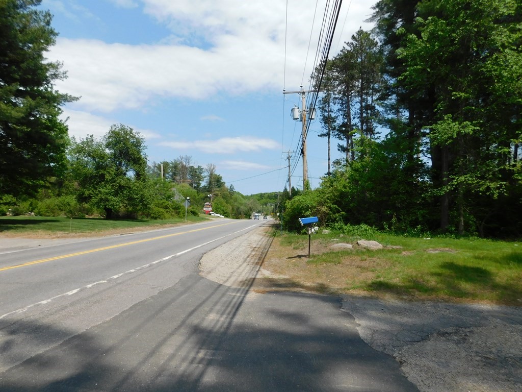 225 Rockingham Road Londonderry, NH 03053 - Photo 4 of 28 a view of a street with a yard