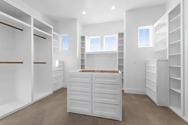 a room with a cabinets and a dresser