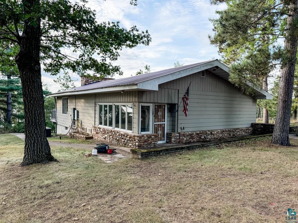 N13431 County Line Road Minong, WI 54859 - Photo 1 of 42 View of front of home featuring a front yard
