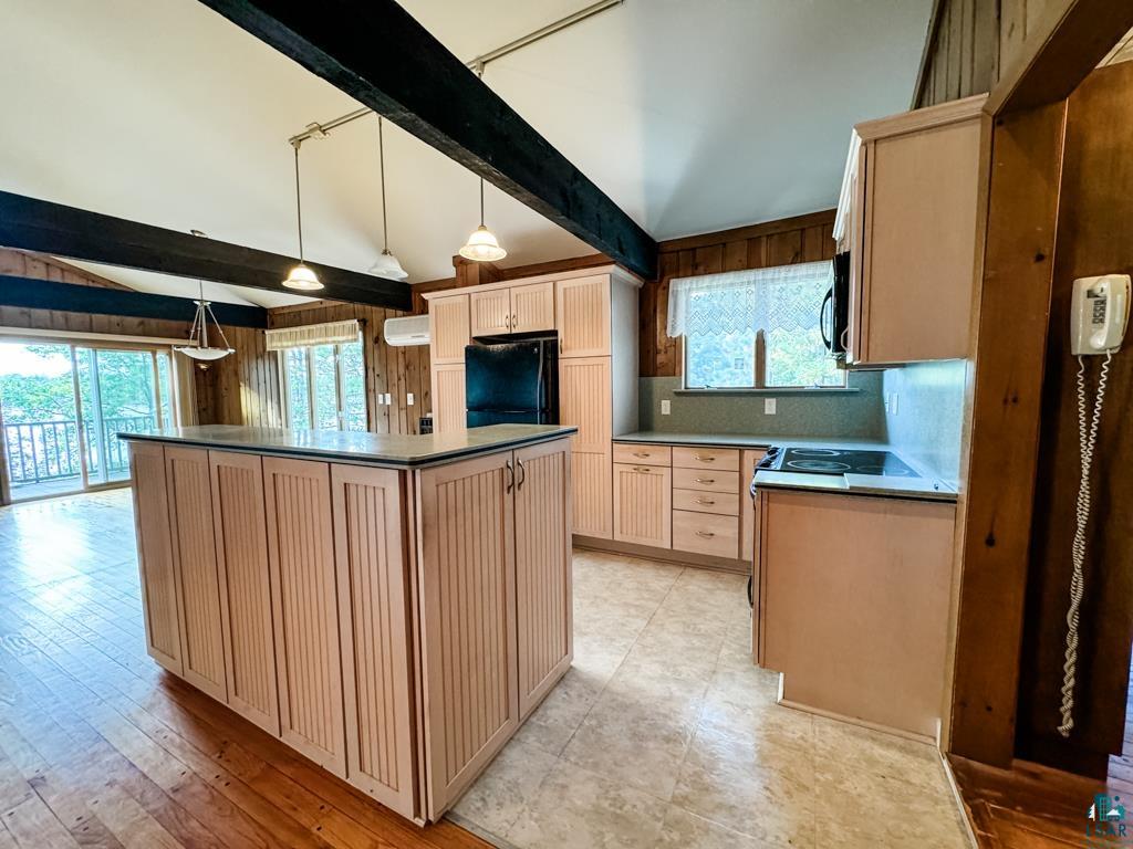 N13431 County Line Road Minong, WI 54859 - Photo 19 of 42 Kitchen with light brown cabinetry, a wealth of natural light, and a kitchen island
