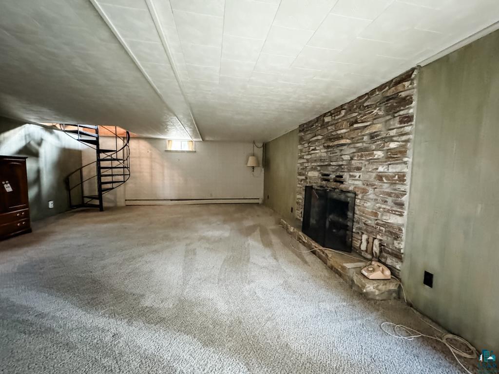 N13431 County Line Road Minong, WI 54859 - Photo 23 of 42 Interior space with a fireplace and carpet