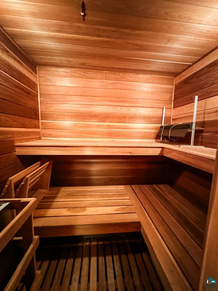 N13431 County Line Road Minong, WI 54859 - Photo 26 of 42 View of sauna featuring wood-type flooring, wooden walls, and wooden ceiling