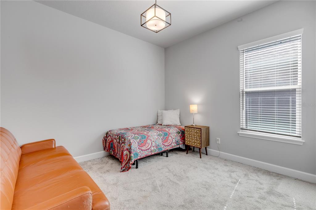 246 Azure Mist Way Daytona Beach, FL 32124 - Photo 15 of 33 a bedroom with bed and a window