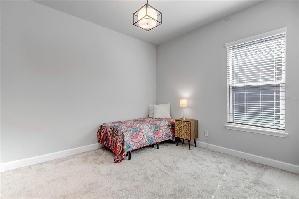 246 Azure Mist Way Daytona Beach, FL 32124 - Photo 15 of 33 a bedroom with a bed and a window