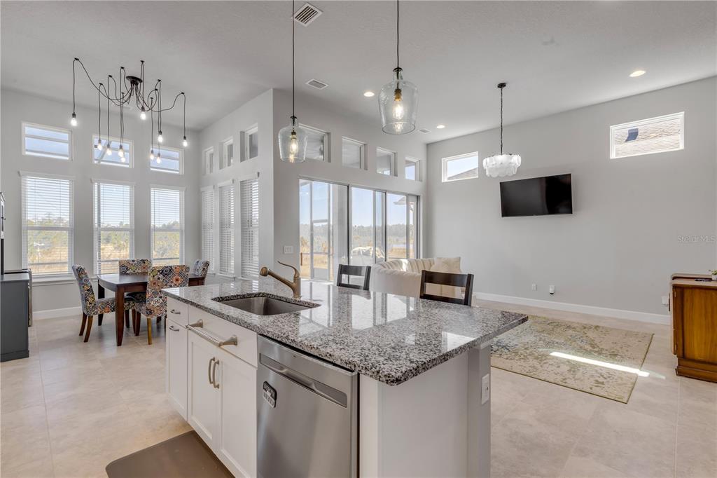 246 Azure Mist Way Daytona Beach, FL 32124 - Photo 9 of 33 a kitchen with sink and view of living room