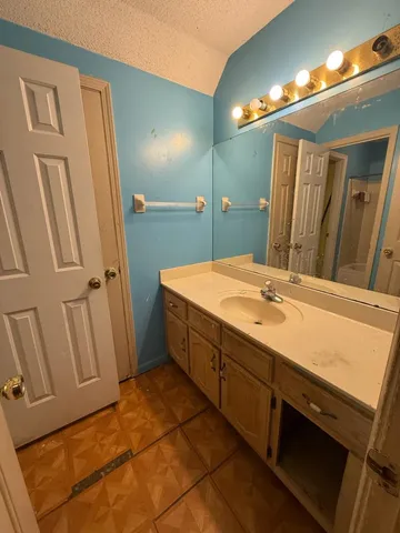 workspace with bathroom and mirror