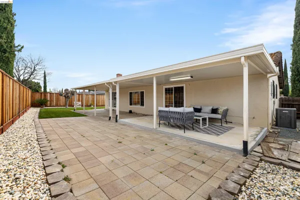 a front view of a house with a yard and porch