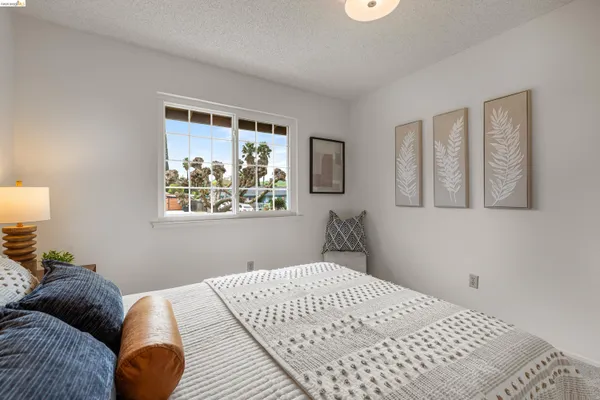 a dining room with furniture a rug and a chandelier