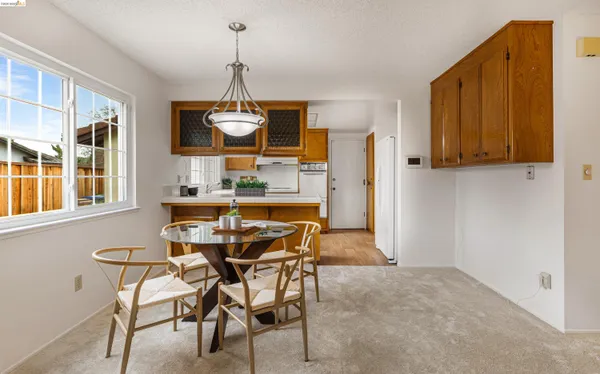 a kitchen with stainless steel appliances granite countertop a sink and a refrigerator