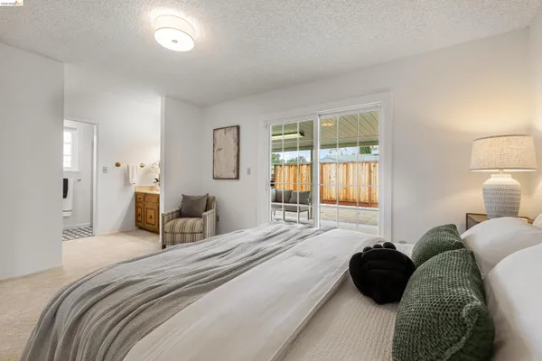 a bedroom with a bed and a couch