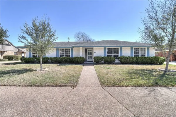 a view of house in front of yard