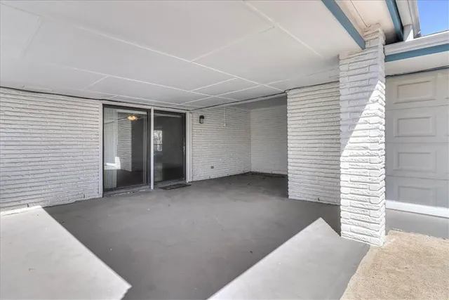 a view of a livingroom with a balcony