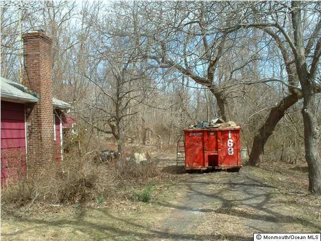 1 Boundary Road Colts Neck, NJ 07722 - Photo 2 of 3 a front view of a house with a yard