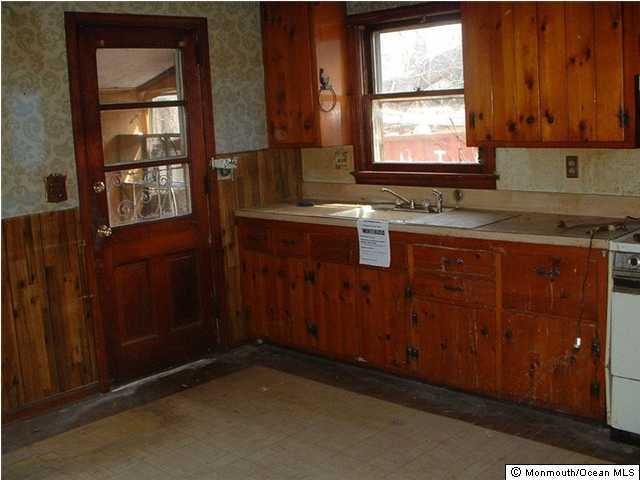 1 Boundary Road Colts Neck, NJ 07722 - Photo 3 of 3 a kitchen with a sink window and cabinets