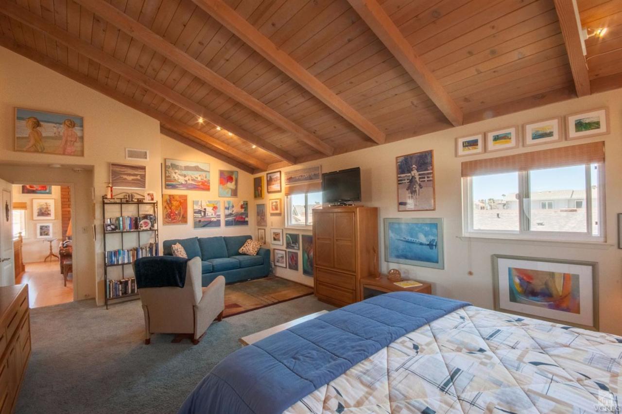 5241 Beachcomber Street Oxnard, CA 93035 - Photo 15 of 21 a bedroom with a bed a couch and dresser