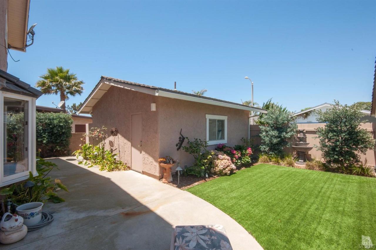 5241 Beachcomber Street Oxnard, CA 93035 - Photo 19 of 21 a front view of a house with garden