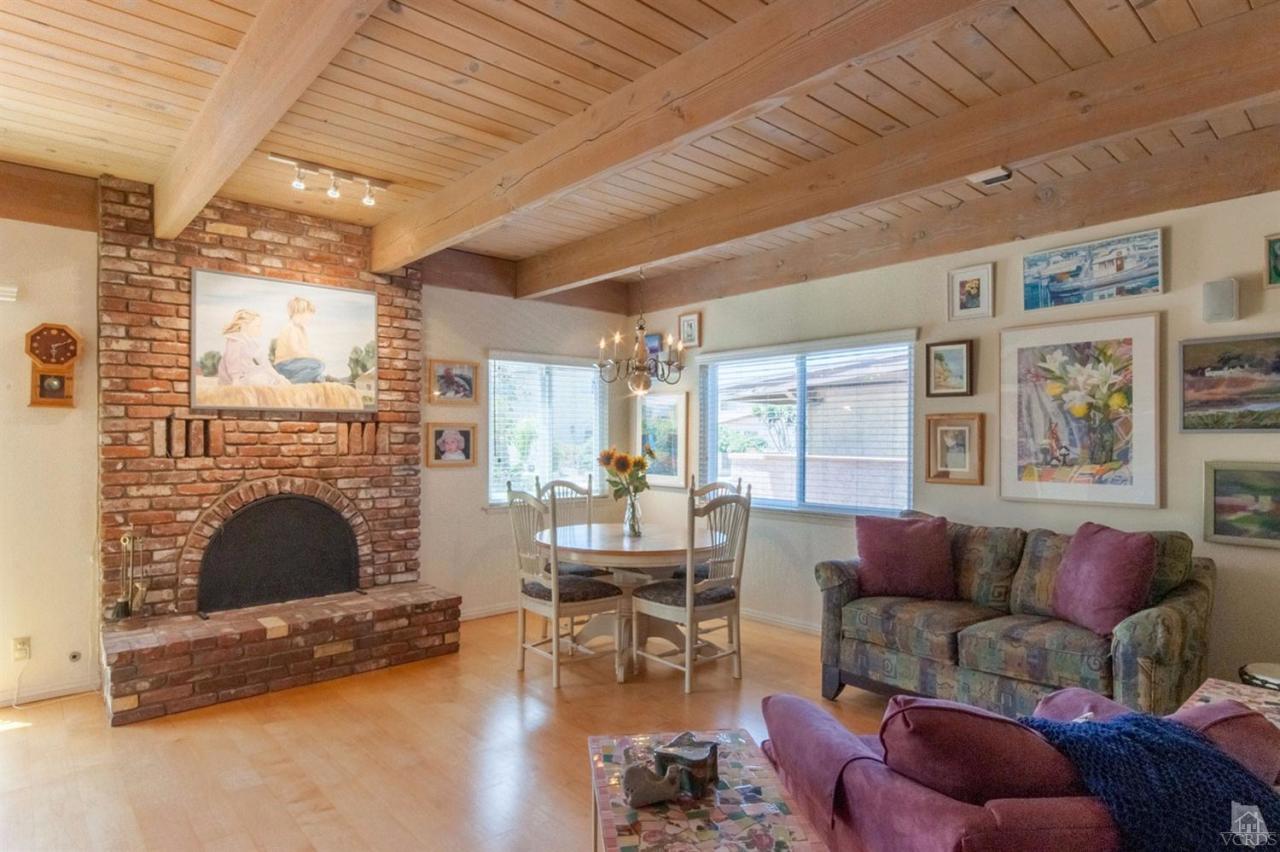 5241 Beachcomber Street Oxnard, CA 93035 - Photo 3 of 21 a living room with furniture and a fireplace