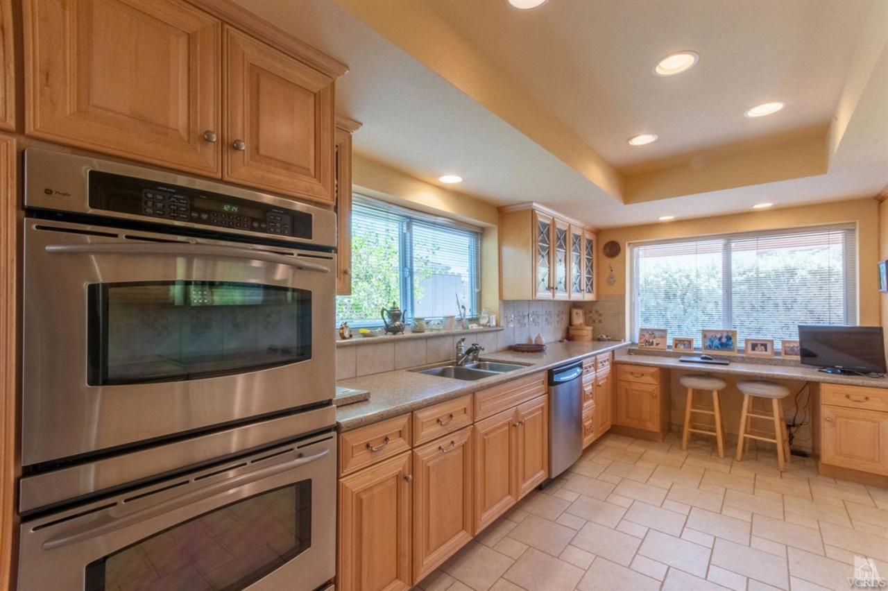 5241 Beachcomber Street Oxnard, CA 93035 - Photo 5 of 21 a kitchen with lots of counter top space and appliances