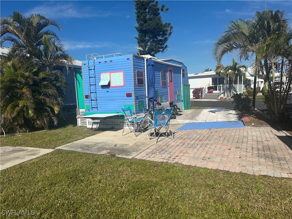 11741 Bubble Shell Drive Fort Myers, FL 33908 - Photo 8 of 11 a view of outdoor space yard and porch