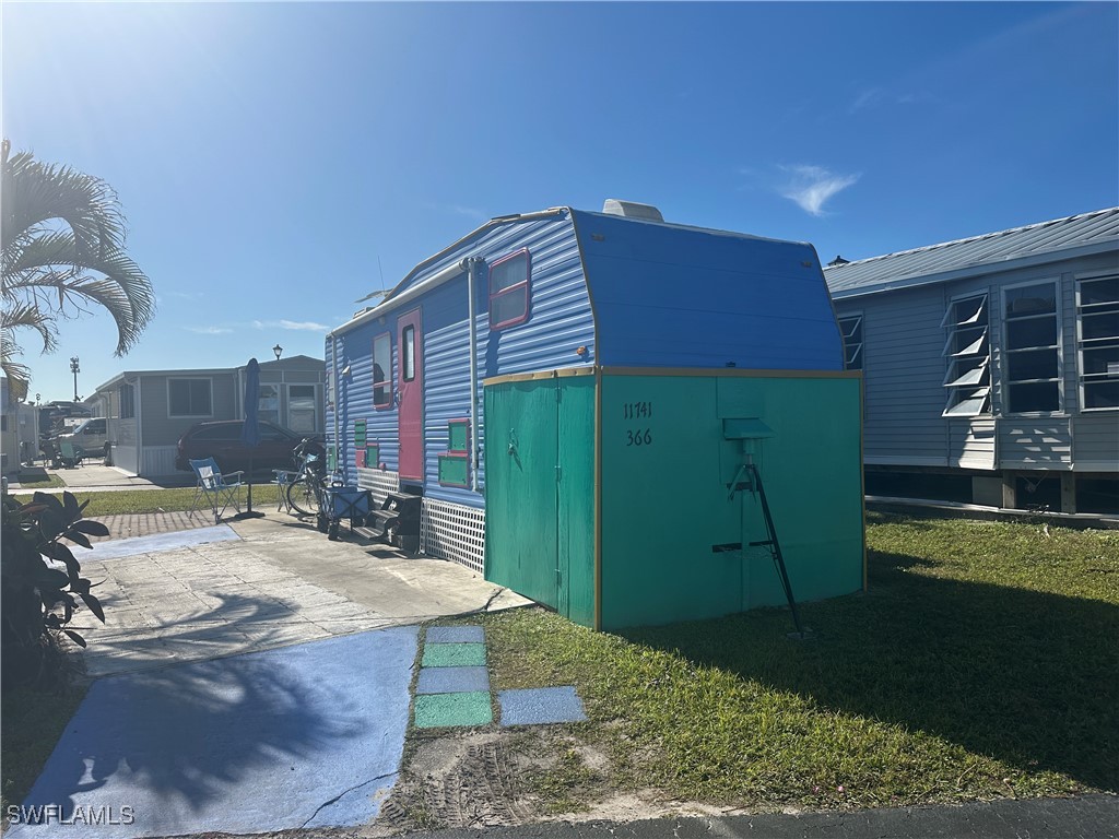 11741 Bubble Shell Drive Fort Myers, FL 33908 - Photo 9 of 11 a bathroom with a sink a toilet and bathtub