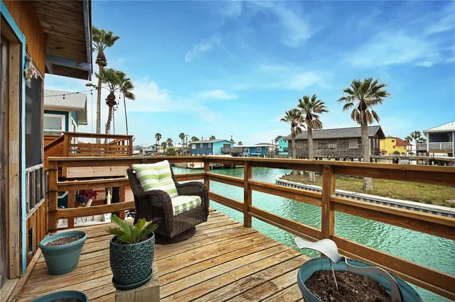 a view of a balcony with chairs