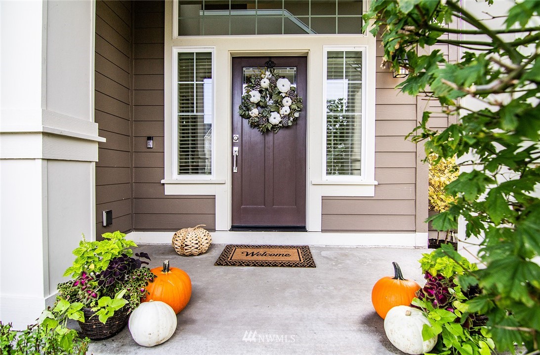 3924 185th Place Southeast Bothell, WA 98012 - Photo 2 of 25 a front view of a house with a yard