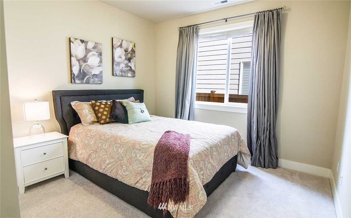 3924 185th Place Southeast Bothell, WA 98012 - Photo 11 of 25 a bedroom with a bed and a window
